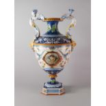 A large Italian Ginori twin handled maiolica vase, designed in the renaissance taste,