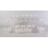 A large suite of cut glass drinking glasses and dishes, 20th century,