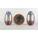 A pair of Belgian flambe glazed twin handled vases, 24cm high,