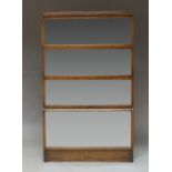 A four section stacking bookcase, early 20th century, with glass sliding drawers, on a plinth base,