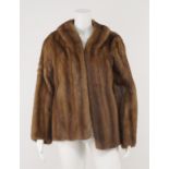 A pastel mink jacket by Calman Links, together with a racoon short jacket, an ermine jacket,