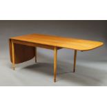 A Danish teak drop leaf dining table, circa 1960, with two additional leaves,