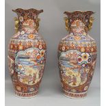 A pair of large Chinese baluster vases, 20th century, with way rims and sea horse handles,