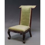 A Victorian mahogany prie dieu chair, carved cabriole legs,