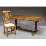 A rectangular dining table, 20th century, with baluster supports, on a H form base,