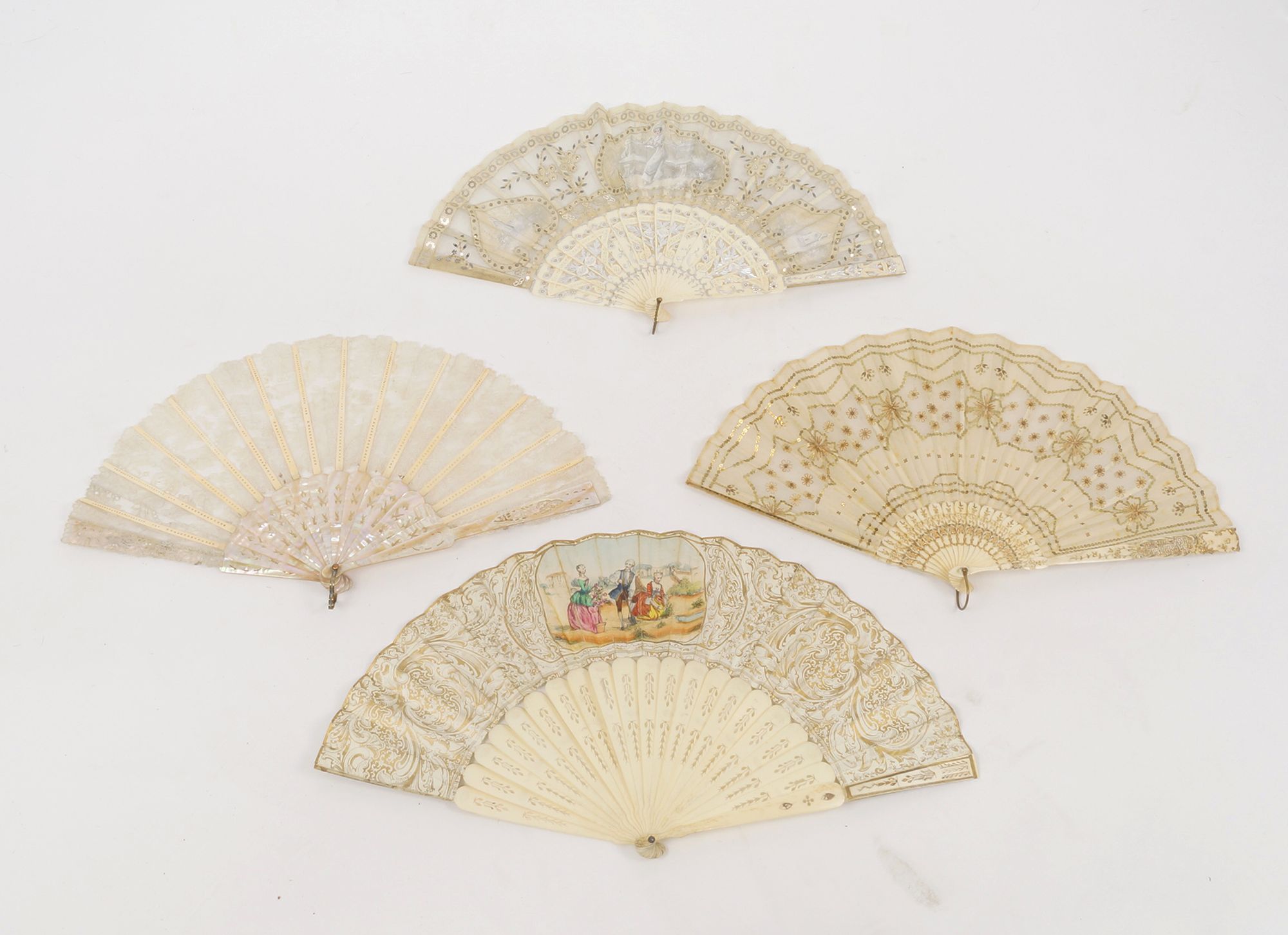 An early 19th century pierced and silvered bone and gauze fan, with three hand painted panels, 23cm,