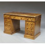 A Victorian walnut pedestal desk, with on long frize drawer flanked by two shorter drawers,