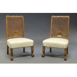 A pair of oak framed low chairs, c.