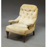 A Victorian button back armchair, upholstered in cream velvet,