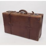 A set of three graduated leather suitcases, largest 74cm x 45cm.