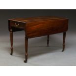 A Victorian mahogany Pembroke dining table the rounded rectangular top above single frieze drawer