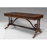 A Regency rosewood and boxwood strung rectangular library table, the front with two frieze drawers