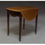 A George III Sheraton style mahogany and crossbanded oval Pembroke table, with single drawer