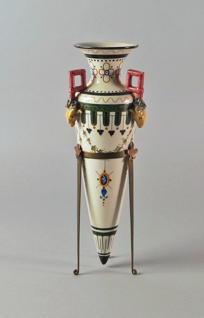 An Italian tin glazed earthenware model of an Amphora, late 19th century, applied with rams head