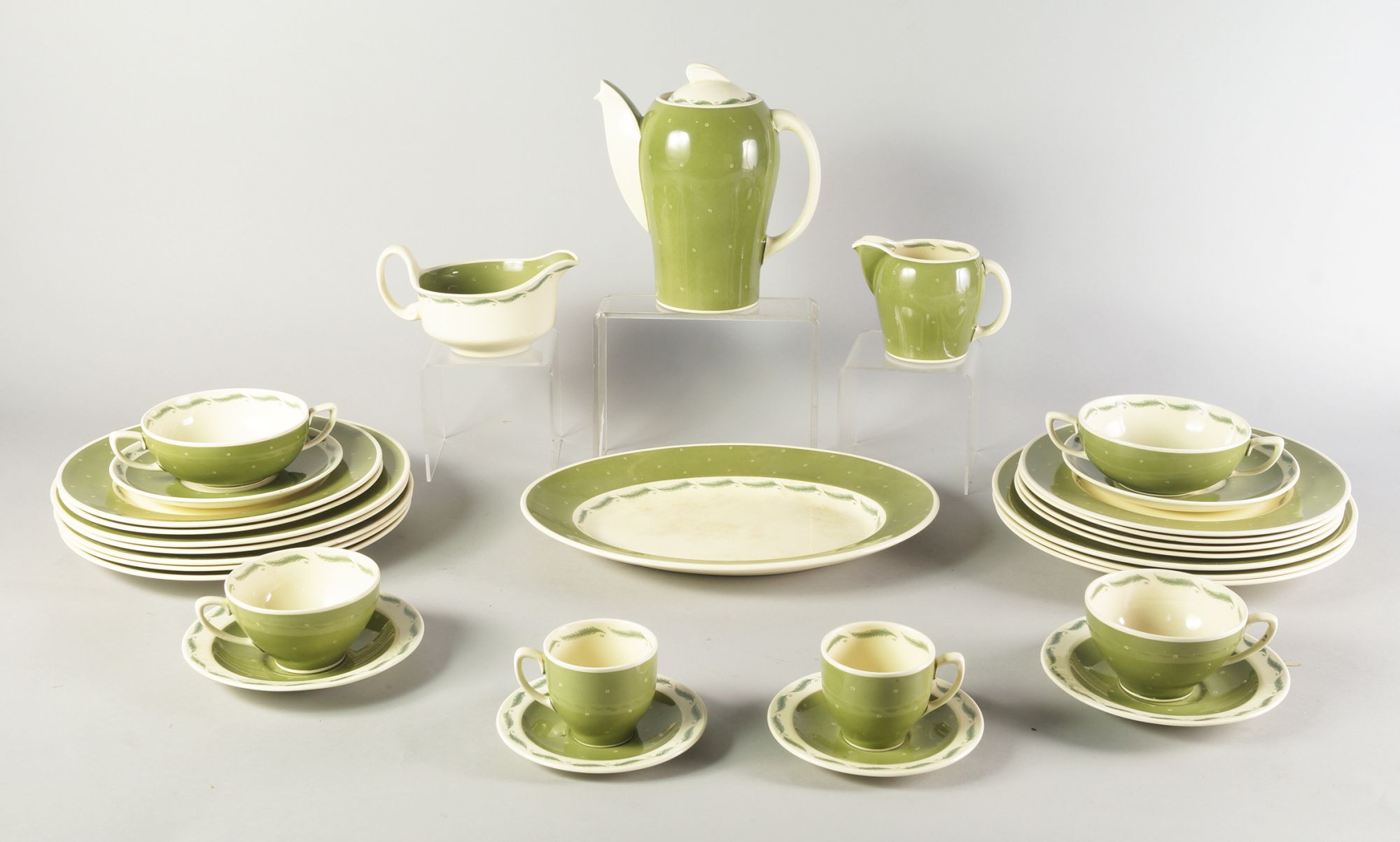 Susie Cooper: a large part dinner and coffee service, decorated with bands of green fern, to