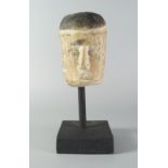 A Tribal carving of head, Central Africa, late 19th/20th century, mounted on a stand, the head