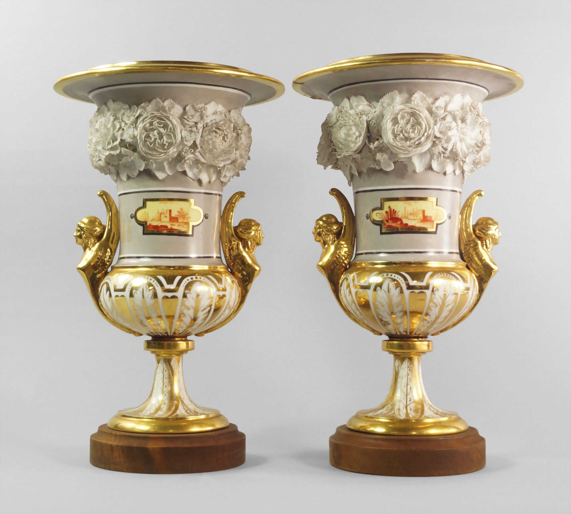 A pair of German porcelain gilt and flower encrusted floral campana urns, early 19th century, each