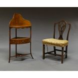 A mahogany corner wash stand, 19th century, with a wedge shaped under tier shelf containing a frieze