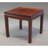 A Chinese hardwood side table, 20th century, of square form, on square supports terminating in