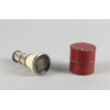 A silver plated and ivory two drawer monocular, 19th century, in a red leather case, 10cm extended