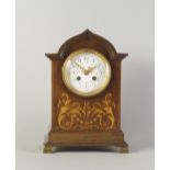 An Edwardian mahogany mantel clock, inlaid to the ogee form case with floral inlay, on plinth base