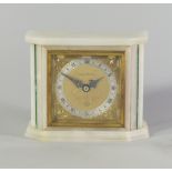 A white onyx and malachite inlaid Elliot mantel clock, stamped with retailers mark for Mappin and