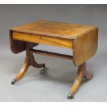 A mahogany sofa table, 20th century, with twin end flaps, above frieze drawer, with reeded end