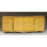 A burr walnut sideboard, early 20th century, with central section as a bar with shelves to the