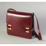 Delvaux, a burgundy leather flap front shoulder bag, adjustable strap, gold plated hardware, with