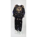 A silk embroidered Chinese robe, c.1920s, worked in cream, ivory and gilt metal threads on a black