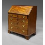 A George III mahogany and line inlaid fall front bureau, fitted to the interior with pigeon holes