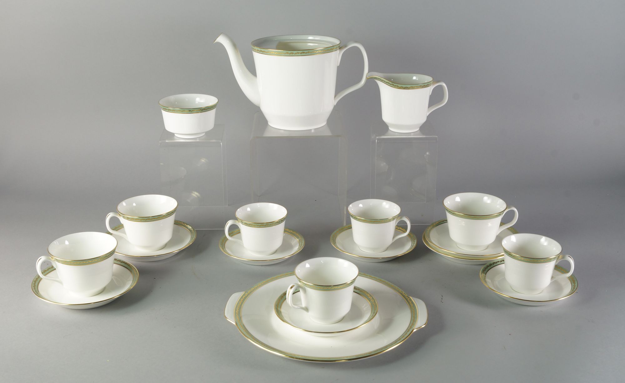 Minton a Milford pattern part tea set to comprise a tea pot lacking cover, four tea cups, four