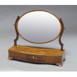 A mahogany and line strung oval toilet mirror, 19th century, 56cm high x 60cm wide x 22cm deep