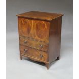 A George III style mahogany cabinet, with lifting lid, and two drawers, containing a record