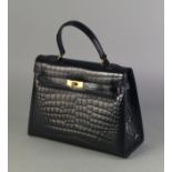 An Osprey black crocodile effect leather Kelly style handbag, with gold plated hardware, 33cm wide