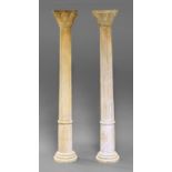 A pair of pine columns, late 19th century, with Corinthian type capitals, on tapering half fluted