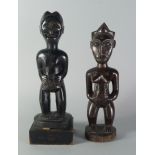 Two Tribal hardwood fertility figures, Baule, late 19th/20th century, one female with stylised