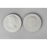 A pair of Russian biscuit porcelain portraits of Tsar Nicholas II and the Tsarina,