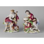 A pair of Continental porcelain figure groups of a man and woman representing the hunt,