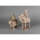 Two Chinese pottery Tang style figures on horseback, standing four square, on rectangular bases,