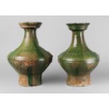 A pair of Chinese green glazed jars, Hu, Han dynasty, with flared mouth,