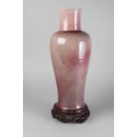 A Chinese porcelain Langyao baluster vase, 19th century, with pale, translucent,