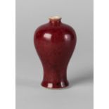 A Chinese sang-de-boeuf miniature meiping vase, Kangxi mark and period,