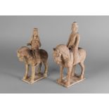 Two Chinese pottery horses and riders, Tang dynasty, standing four square, one with straw glaze,