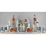 Twenty Chinese porcelain figures, 18th-19th century, to include beautiful maiden candle holders,