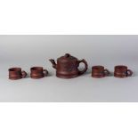 A Chinese Yixing teapot and four cups, 20th century,