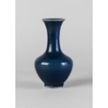 A Chinese porcelain monochrome blue bottle vase, 18th/19th century,