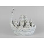 A Chinese blanc de chine porcelain figure group of immortals in a boat, Dehua, Qing dynasty,