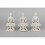 Three Chinese porcelain seated figures of Lohan, 19th century, with pale crackle glaze,