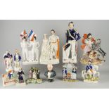 A collection of Staffordshire figures, mostly 19th century, to comprise the Queen and King of